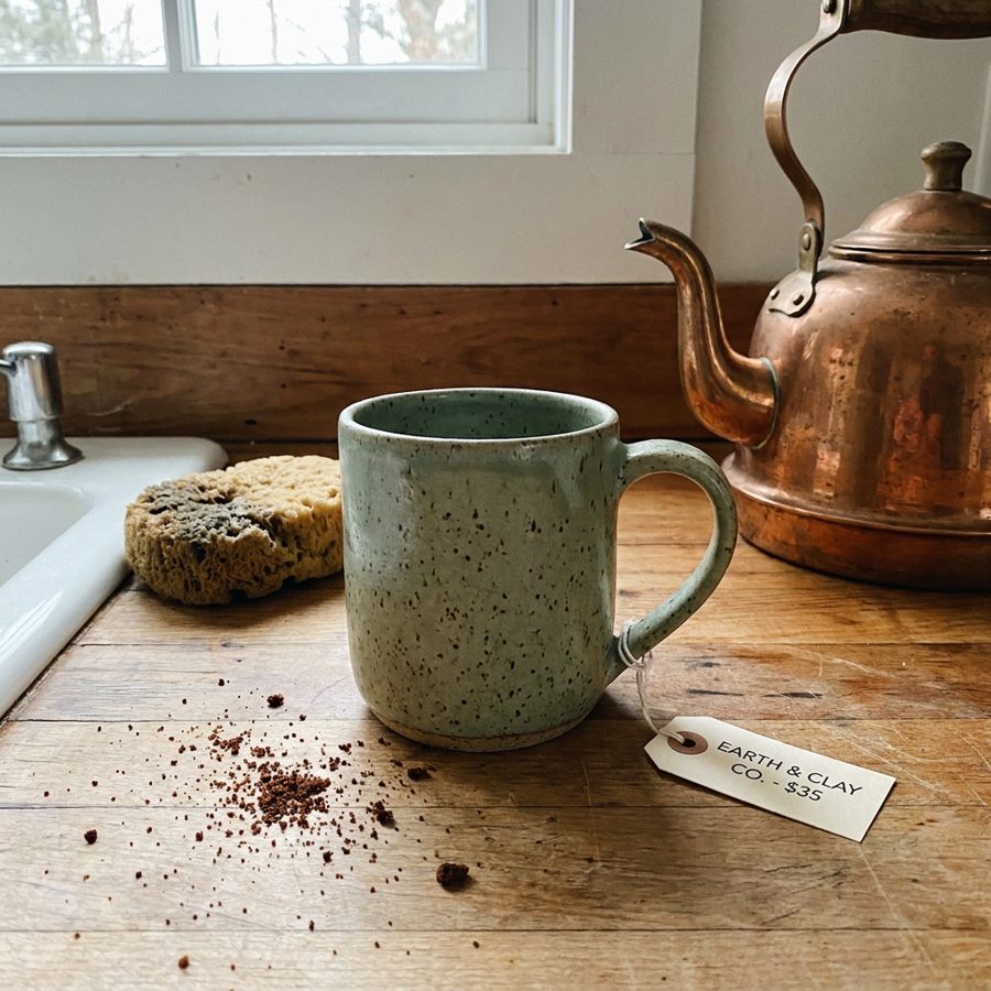 Speckled green mug on a kitchen counter